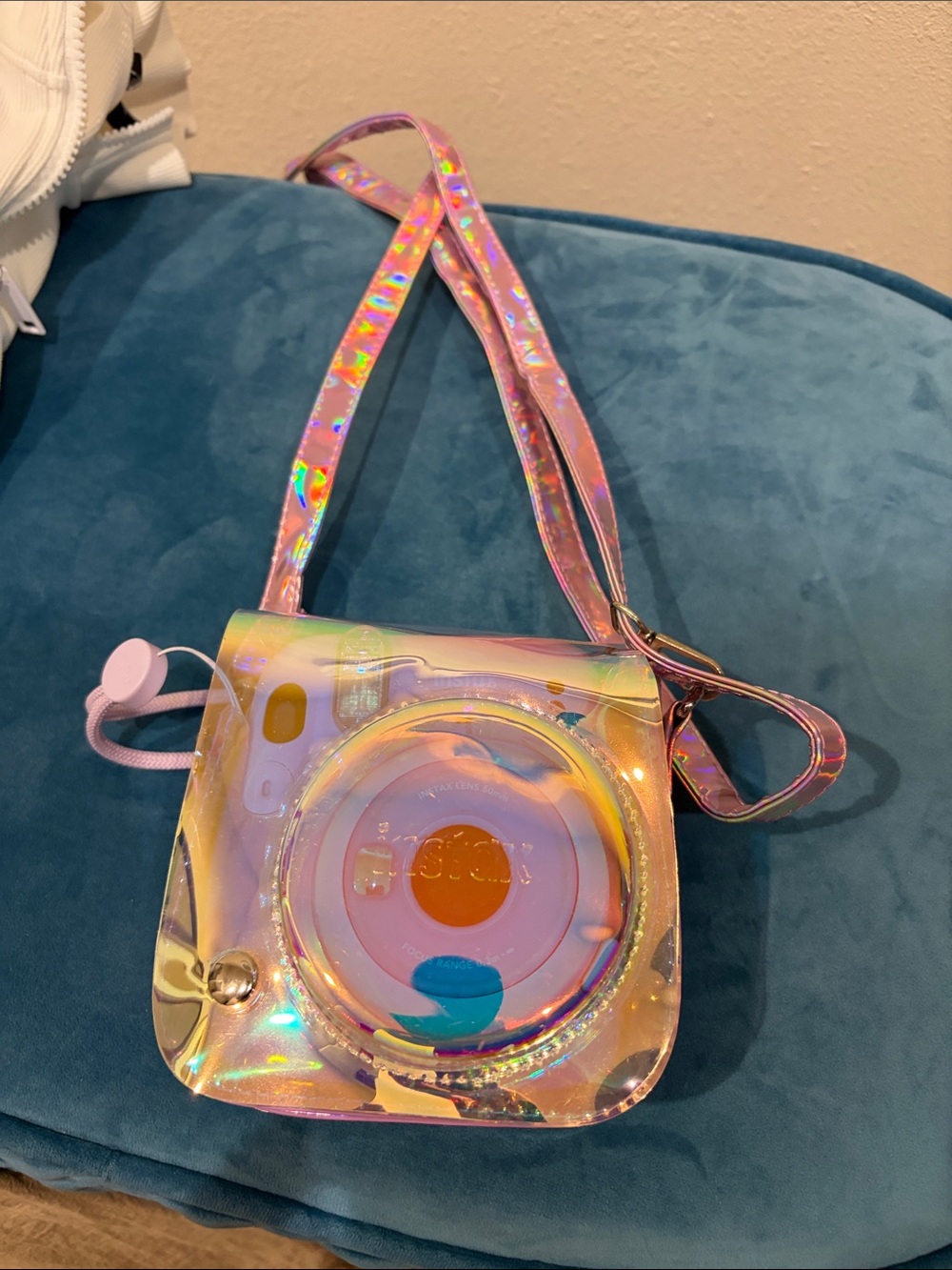 Fujifilm instax mini 11 camera with stylish metallic cross body bag.